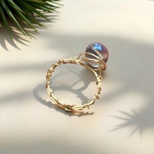 Elegant Gold and Purple Ring